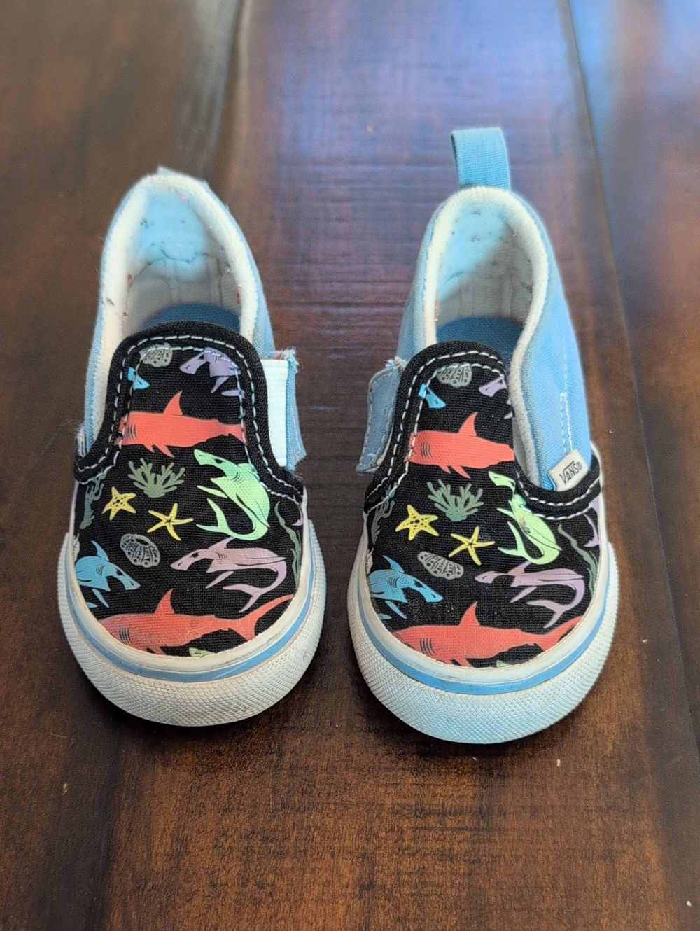 Vans Baby Slip-On Shark Print Sneakers in Black and Light Blue